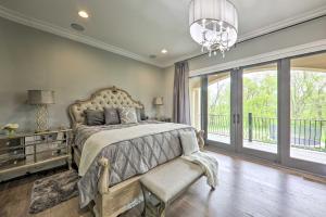 a bedroom with a large bed and a chandelier at Huge Lebanon Estate with Resort-Style Amenities in Lebanon