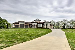 a large house on a green field with a walkway at Huge Lebanon Estate with Resort-Style Amenities in Lebanon