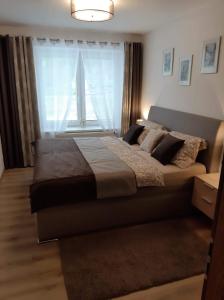 Postel nebo postele na pokoji v ubytování Apartmán pod hradem