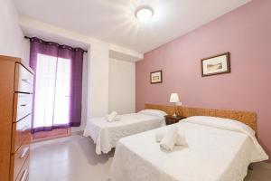 Postel nebo postele na pokoji v ubytování Apartamentos Nuevo México C 372