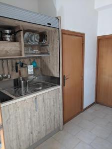 Kuchyň nebo kuchyňský kout v ubytování Residence Cala delle Arene + 37 fotografií