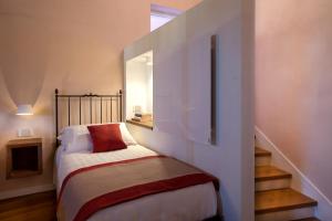 a small bedroom with a bed and a window at Dimora del Leone Gaeta in Gaeta