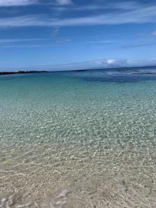 a large body of water with a beach at Ard Na Mara Self Catering Isle of Mull in Dervaig