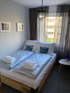 Posteľ alebo postele v izbe v ubytovaní Apartament Komorowskiego