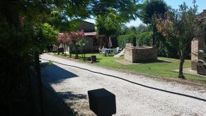 a road with a tv on the side of a house at B&B Il Cascinale in Bettona