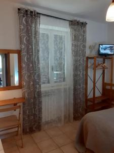 Postel nebo postele na pokoji v ubytování Life B&B