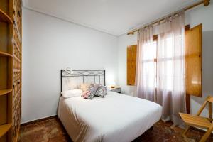 Łóżko lub łóżka w pokoju w obiekcie Holi-Rent Estrella
