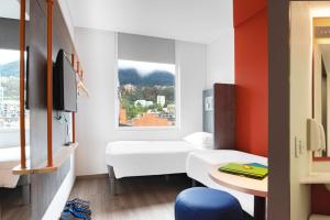 Postel nebo postele na pokoji v ubytování ibis budget Bogota Marly + 37 fotografií