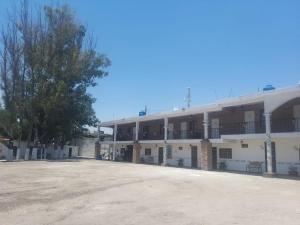 an empty parking lot in front of a building at Hotel La Cabaña in San Miguel de Allende