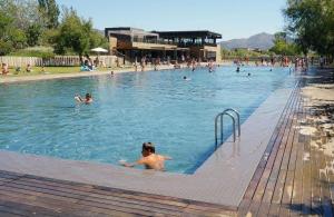 a group of people swimming in a swimming pool at Empuriabrava 500m de la plage de la Rubina in Empuriabrava