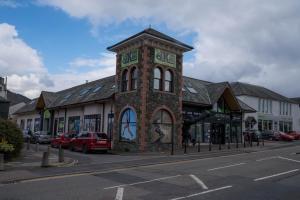 a building with a clock tower on the side of a street at Low Haven in Keswick