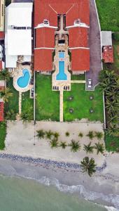 an aerial view of a house on the beach at Manga Verde Beach Residence in Itamaracá +213 photos