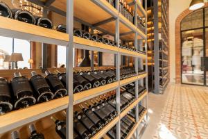 a room filled with lots of wine bottles at Bengodi Boutique Hotel in Eceabat