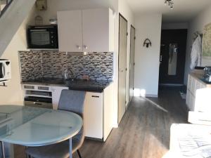 Кухня или кухненски бокс в Appartement Hauteur Barcelonnette Vue Exceptionnelle