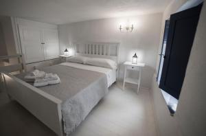 Postel nebo postele na pokoji v ubytování Villa Insolia
