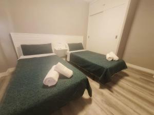 Postel nebo postele na pokoji v ubytování Primera línea Morro de Goss