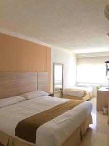 Vajamar Hotel tesisinde bir odada yatak veya yataklar