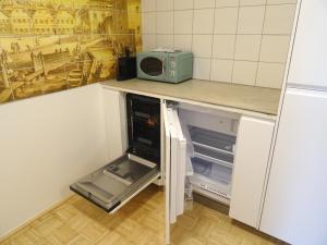 Kuchyň nebo kuchyňský kout v ubytování Convenient and Functional Apartment in the Center