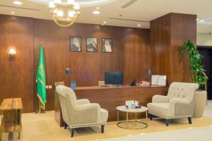 a waiting room with two chairs and a desk at 92 - وحدات فندقية - in Unayzah