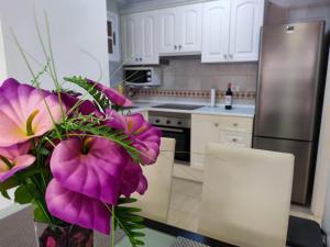 A kitchen or kitchenette at Los Cristianos - heated swimming pool air-conditioned