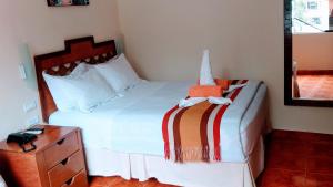 Voodi või voodid majutusasutuse Hostal Vista Waynapata 123 toas