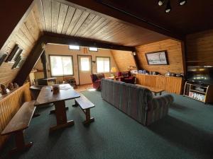 a living room with a couch and a table at Mittenwald in Bessemer