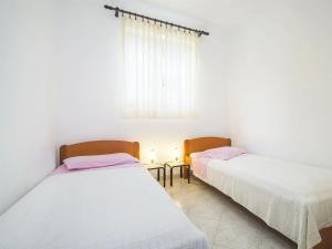 Postel nebo postele na pokoji v ubytování Apartments Iris
