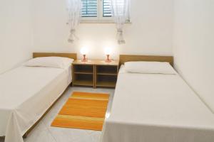 Postel nebo postele na pokoji v ubytování Apartments Iris
