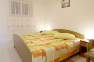 Postel nebo postele na pokoji v ubytování Apartments Iris