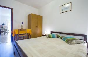 Postel nebo postele na pokoji v ubytování Apartments Iris