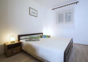 Postel nebo postele na pokoji v ubytování Apartments Iris