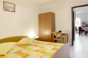 Postel nebo postele na pokoji v ubytování Apartments Iris