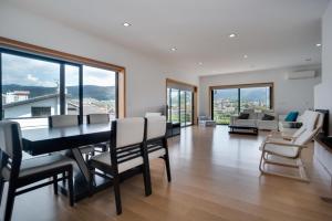 a dining room with a table and chairs at Casa de Coelhosa in Vale de Cambra