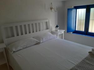 Postel nebo postele na pokoji v ubytování Villa Insolia
