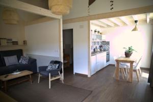 a living room with a couch and a table at Casa Rural Baltasar in Aliaguilla