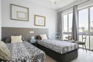 Postel nebo postele na pokoji v ubytování Apartment Leonor