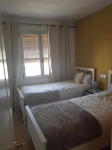 Postel nebo postele na pokoji v ubytování Apartment Leonor