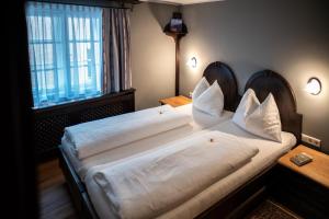 Voodi või voodid majutusasutuse Altstadt Hotel Stadtkrug toas