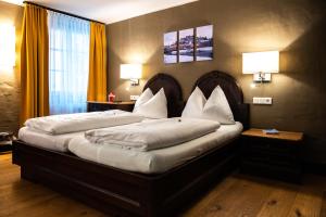 Voodi või voodid majutusasutuse Altstadt Hotel Stadtkrug toas
