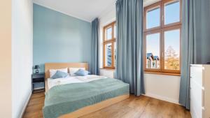 Postel nebo postele na pokoji v ubytování Apartamenty Sun & Snow Międzyzdroje Promenada