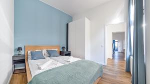 Postel nebo postele na pokoji v ubytování Apartamenty Sun & Snow Międzyzdroje Promenada