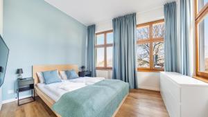 Postel nebo postele na pokoji v ubytování Apartamenty Sun & Snow Międzyzdroje Promenada