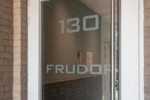 a window of a building with the word fudoc on it at Frudor 0401 in Koksijde