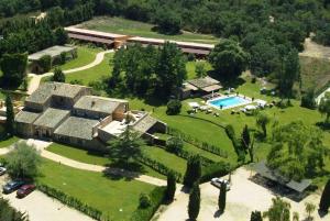 an aerial view of a mansion with a swimming pool at Mas Salvi Country Boutique Hotel in Pals