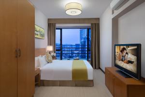 Katil atau katil-katil dalam bilik di Springdale Serviced Residence Guangzhou