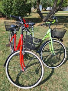 two bikes parked next to each other on the grass at Apartman Luka in Novigrad Istria