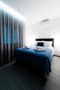 Postel nebo postele na pokoji v ubytování Athena Center Apartments