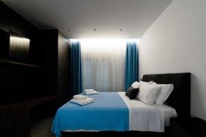 Postel nebo postele na pokoji v ubytování Athena Center Apartments