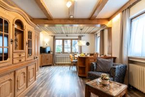 a living room with a couch and a table at Ferienwohnung Anna in Garmisch-Partenkirchen