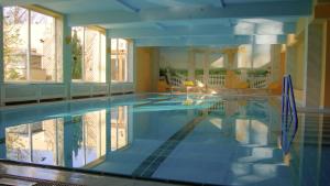 a swimming pool in a house with a pool at Hotel Marienhof in Reichenau